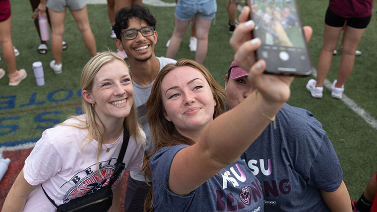 Selfie with friends at a campus event.